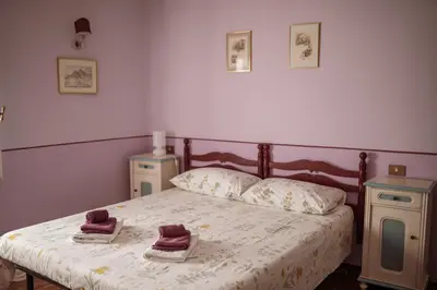 Letto o letti in una camera di Villa Maddalena - Cerrolungo