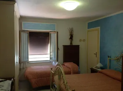 Letto o letti in una camera di Albergo Elisa