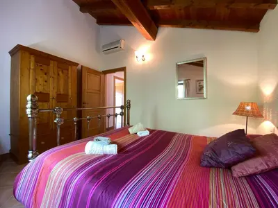 Letto o letti in una camera di Villa Il Nido 8 Pax by VILLASRETREATS