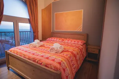 Letto o letti in una camera di Agriturismo Corte Alussi