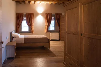 Letto o letti in una camera di Agriturismo Corte Alussi