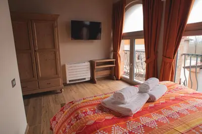 Letto o letti in una camera di Agriturismo Corte Alussi