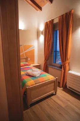 Letto o letti in una camera di Agriturismo Corte Alussi