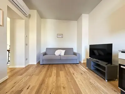 TV o dispositivi per l'intrattenimento presso Trilocale, 2 camere da letto, parcheggio gratuito