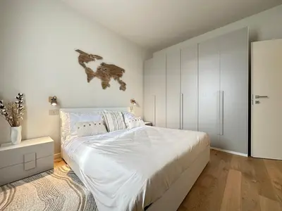 Letto o letti in una camera di Trilocale, 2 camere da letto, parcheggio gratuito