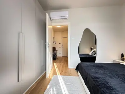 Letto o letti in una camera di Trilocale, 2 camere da letto, parcheggio gratuito