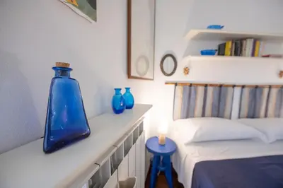 Letto o letti in una camera di 274b- Casa delle Due Baie, 10 minuti a piedi dalla Baia del Silenzio e dal Centro Storico