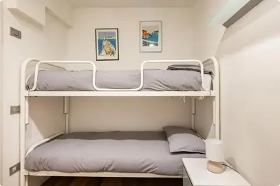 Letto o letti in una camera di Casa Garibaldi