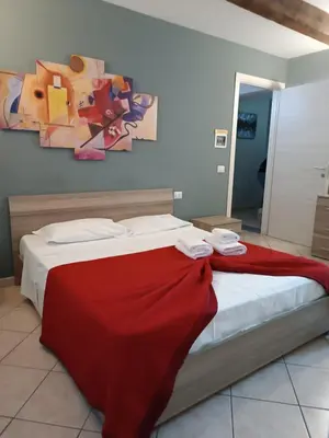 Letto o letti in una camera di CAMERA EMILIA via emilia ovest 224