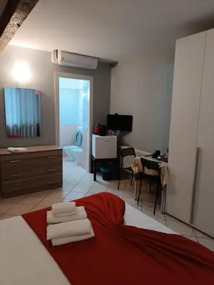 Letto o letti in una camera di CAMERA EMILIA via emilia ovest 224
