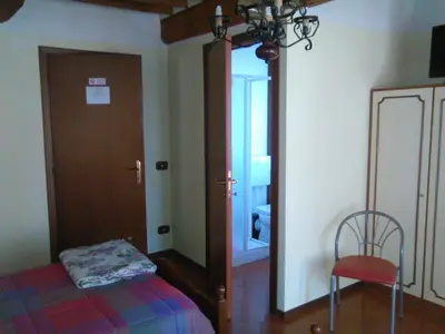 Letto o letti in una camera di BeB Reboglio