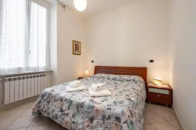 Letto o letti in una camera di GuestHost - A Casa di Eufemia - Migliarina Station Apartment
