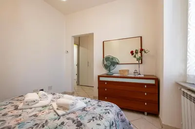 Letto o letti in una camera di GuestHost - A Casa di Eufemia - Migliarina Station Apartment