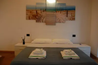 Letto o letti in una camera di Villa nel verde con vista mare, Rapallo