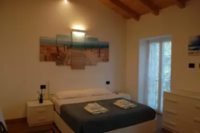 Letto o letti in una camera di Villa nel verde con vista mare, Rapallo