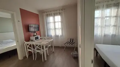 Letto o letti in una camera di DUCATO HOTEL e RESIDENCE