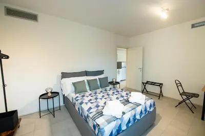 Letto o letti in una camera di Loft Smart Parma l Wi-Fi Fibra, Indipendente, Perfetto per Business e Coppie