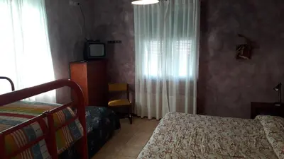 Letto o letti in una camera di La Casa Rosa