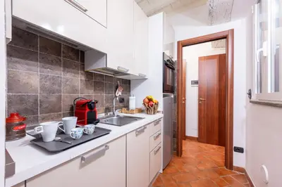 Cucina o angolo cottura di GuestHost - Piazza San Bartolomeo Bright&Comfy Apt x4