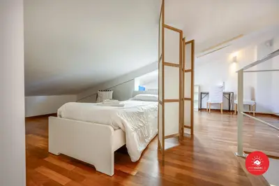 Letto o letti in una camera di Unique