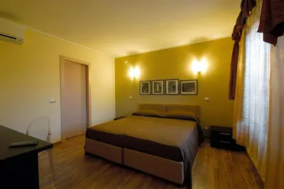 Letto o letti in una camera di Affittacamere Il Persicone