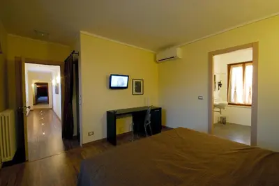 Letto o letti in una camera di Affittacamere Il Persicone