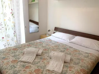 Letto o letti in una camera di Appartamentino via Garibaldi
