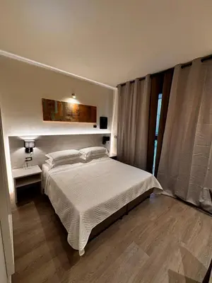 Letto o letti in una camera di Confidence Hotel Parma