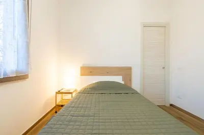 Letto o letti in una camera di La Nonantolana Apartment - Eden e Ocean