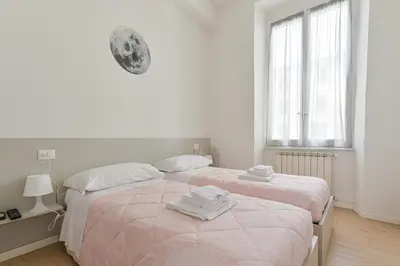 Letto o letti in una camera di Le Case sul Parco 2