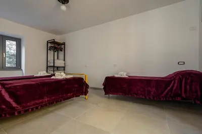 Letto o letti in una camera di GuestHost - Oltre il Mare - Peaceful Retreat in Liguria