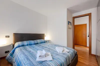 Letto o letti in una camera di GuestHost - La Casetta del Golfo - La Spezia Apartment
