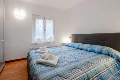 Letto o letti in una camera di GuestHost - La Casetta del Golfo - La Spezia Apartment