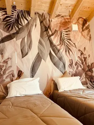 Letto o letti in una camera di La Casa nel bosco