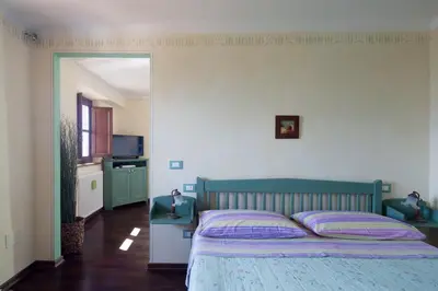 Letto o letti in una camera di B&B La Pulce Dorata