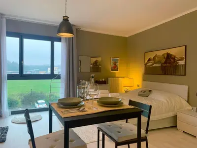 Area soggiorno di Parma Business Apartment