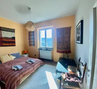 Letto o letti in una camera di Una casa nel verde sulle colline di Lavagna