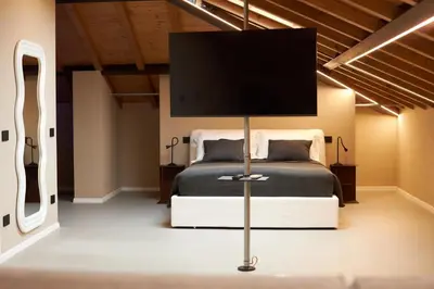 Letto o letti in una camera di SUITE Don Alfonso