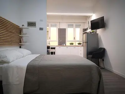 Letto o letti in una camera di Cantiere Home