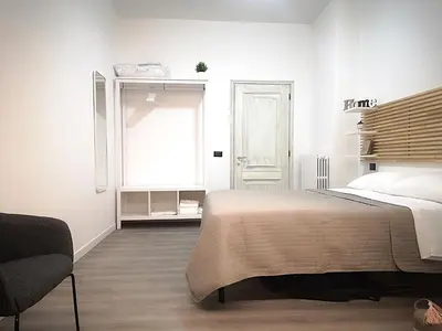 Letto o letti in una camera di Cantiere Home