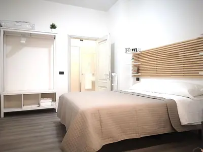 Letto o letti in una camera di Cantiere Home