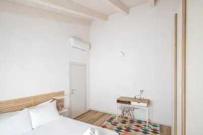 Letto o letti in una camera di Mansarda del Duca