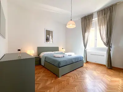 Letto o letti in una camera di Vista Ghirlandina - Attico sul tetto del centro al settimo piano