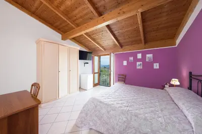 Letto o letti in una camera di Agriturismo Daniela