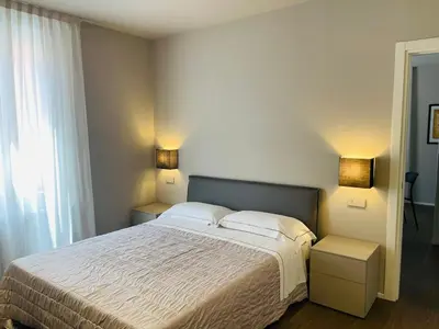 Letto o letti in una camera di La Bella Modena Giardini Appartamenti