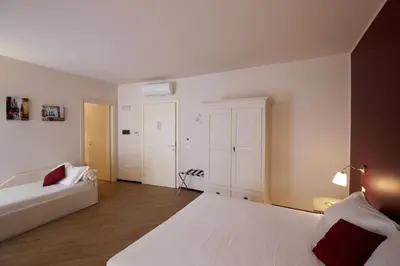 Letto o letti in una camera di Hotel Leon D'Oro