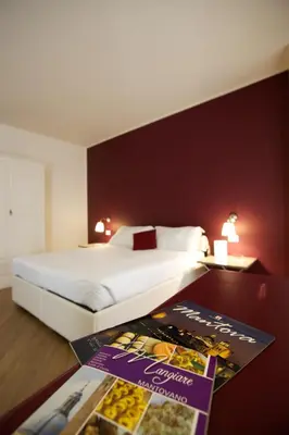 Letto o letti in una camera di Hotel Leon D'Oro