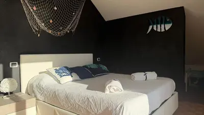 Letto o letti in una camera di Attico con terrazza fronte mare a Cavi di Lavagna