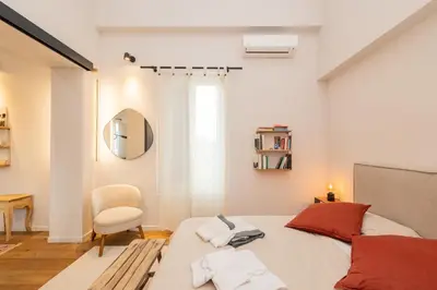 Letto o letti in una camera di La Dimora degli Artisti - Elegante appartamento con parcheggio privato