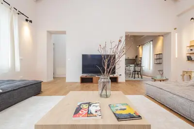 Area soggiorno di La Dimora degli Artisti - Elegante appartamento con parcheggio privato